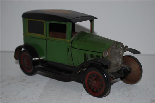 Ford Model A 2-door sedan tin litho car, with ‘the New Ford’ on the top, 7 inches, $990. Image courtesy of Matthews Auctions LLC.